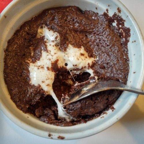 Just like hot chocolate bombs themselves, this hot chocolate bomb mug cake has a center filled with hot chocolate fixins. Rich dark chocolate chips and gooey marshmallows melt in the microwave while the chocolate cake cooks. Dig your fork into the mug cake and it’s ooey gooey hot chocolate heaven. This single serving chocolate dessert recipe is my new favorite