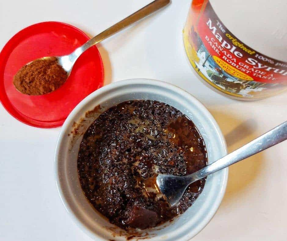 The world can always use more chocolate. This 3-ingredient mug cake is a quick way to satisfy your chocolate cravings. This healthy chocolate mug cake is flourless, refined sugar-free and oil-free too! | keto mug cakes, weight watcher recipes, single serving desserts, healthy snacks, healthy desserts, paleo desserts, gluten-free cake