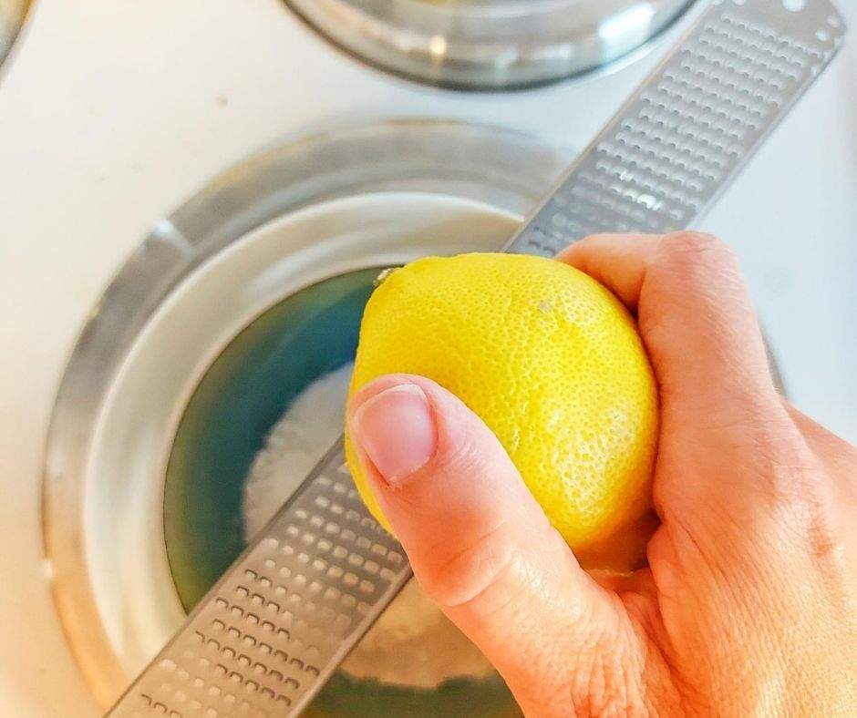 Zesting a lemon into a bowl