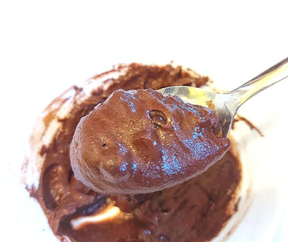 Mug brownie batter on a spoon