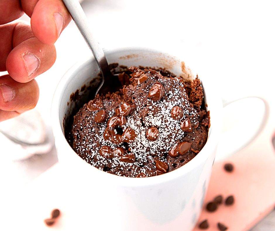 vegan mug brownie with spoonful and chocolate chips