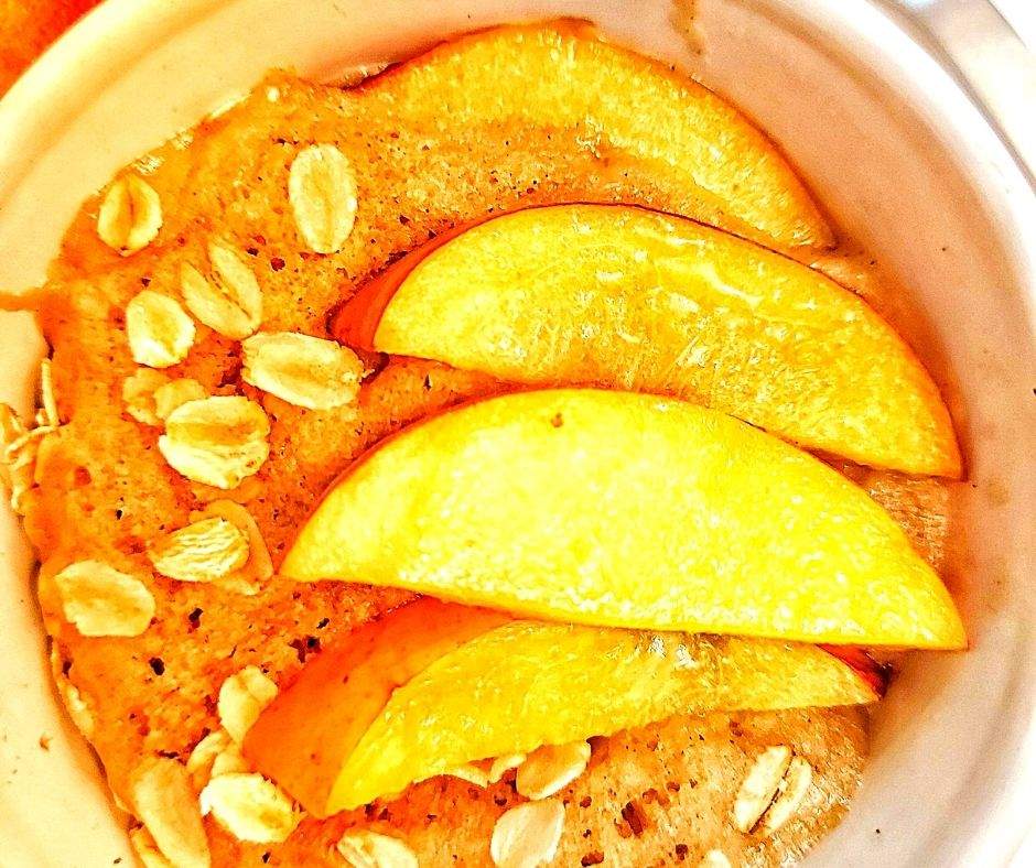 This peach mug cake is an easy dessert that can be prepared in just a few minutes. It's a single-serving treat that combines the sweetness of ripe peaches with the warm, comforting goodness of a cake.